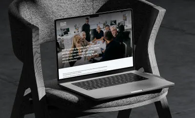 mockuuups macbook pro mockup on a textured chair with dramatic shadows
