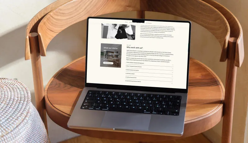 mockuuups macbook pro mockup on a round wooden table 1