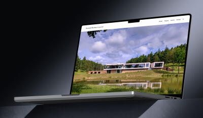 mockuuups macbook pro 16 inch mockup on a textured tabletop with dramatic lighting