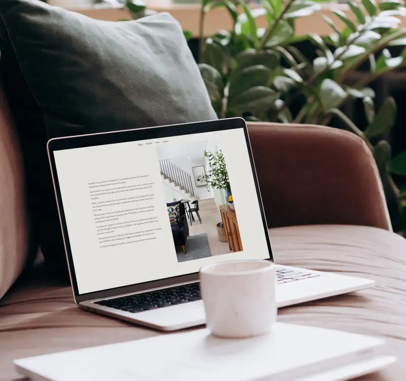 mockuuups macbook pro mockup on a sofa with coffee and documents