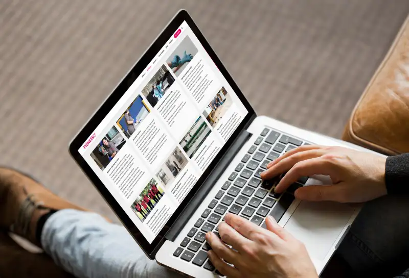 mockuuups sitting and typing on macbook pro mockup