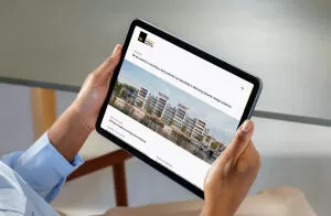 mockuuups ipad air mockup in a womans hand at a modern office