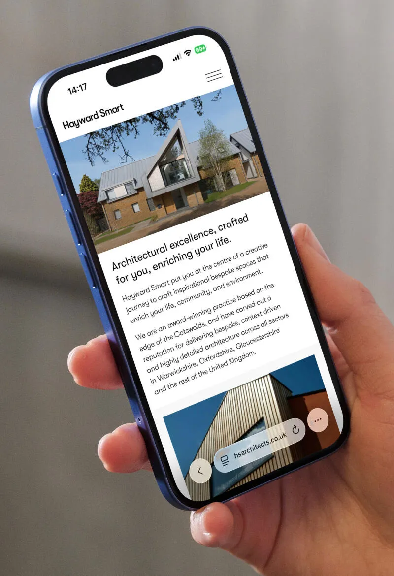 mockuuups iphone 16 mockup held in a womans hand against concrete background