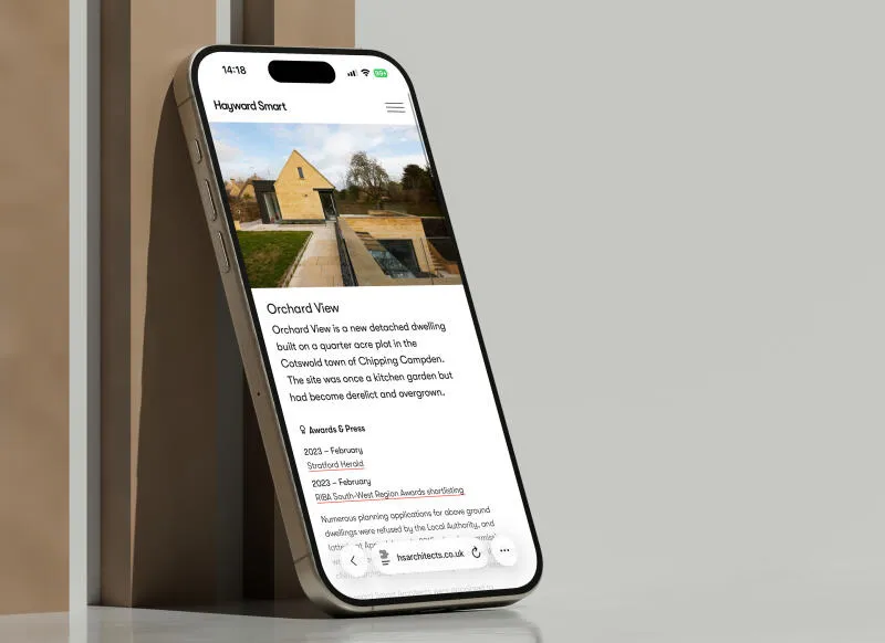 mockuuups iphone 16 mockup standing on reflective surface with geometric backdrop