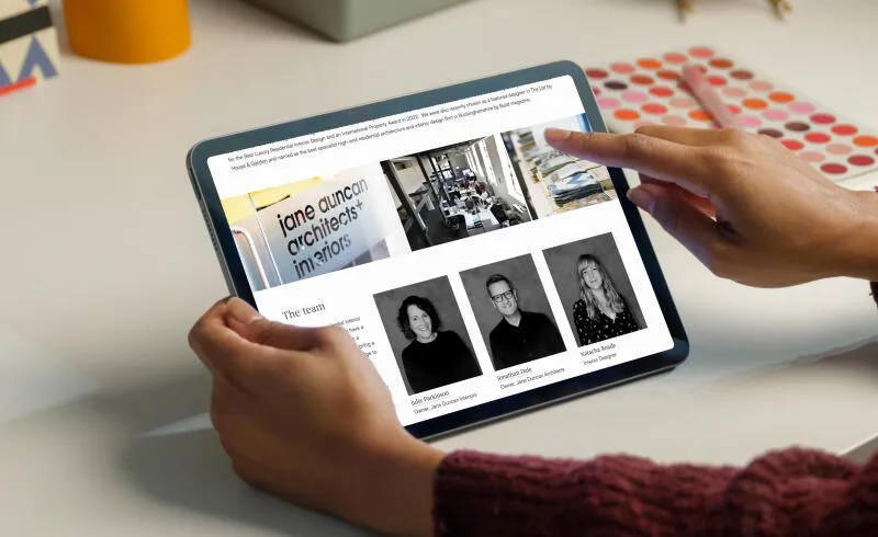 mockuuups woman working on an ipad air mockup 2