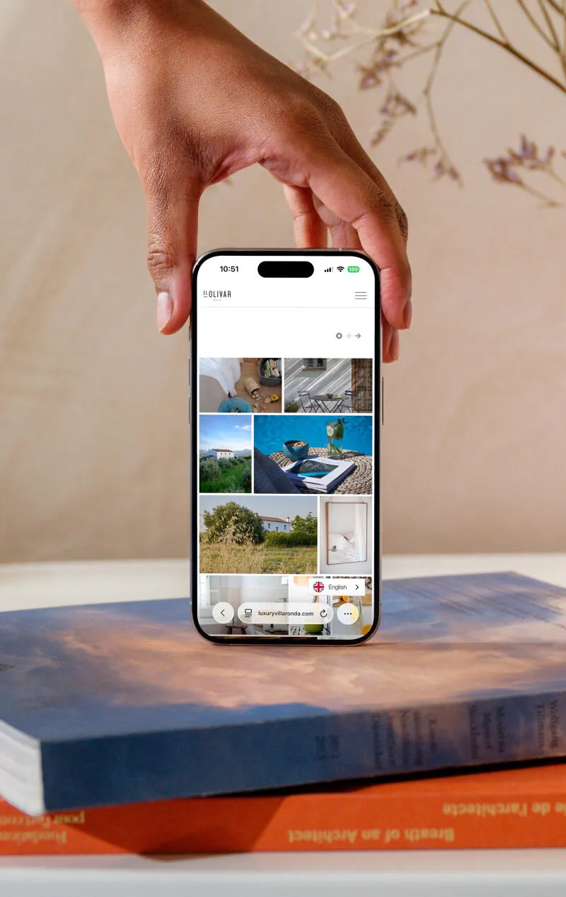 mockuuups iphone 15 pro mockup in a womans hand on a modern home setting