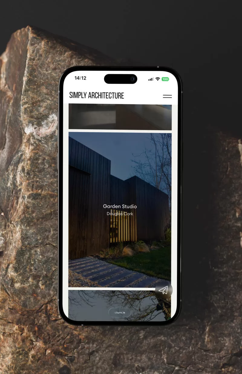 mockuuups iphone mockup positioned on a textured rock surface