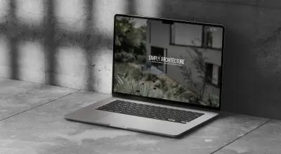 mockuuups macbook air mockup on a concrete surface