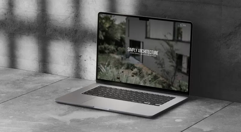 mockuuups macbook air mockup on a concrete surface