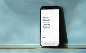 mockuuups iphone 14 pro and blue patterned background