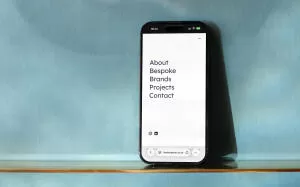 mockuuups iphone 14 pro and blue patterned background