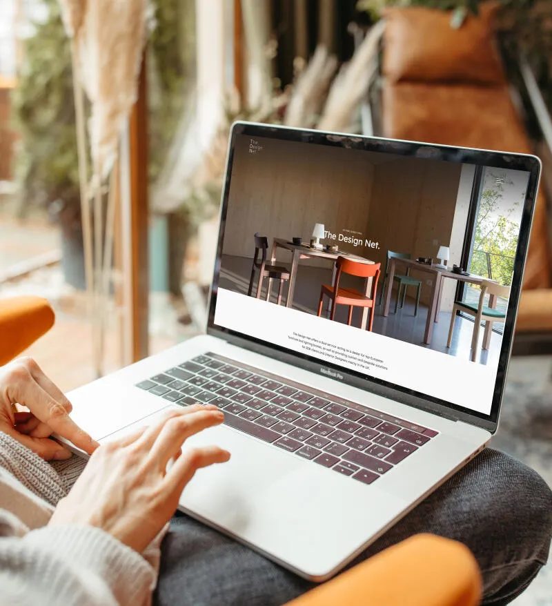 mockuuups person typing on a macbook pro mockup